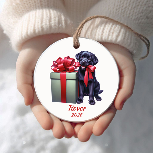 Personalized black Labrador Retriever Christmas ornament held in cupped hands