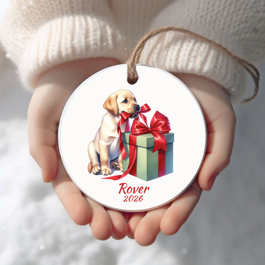 Personalized yellow Labrador Retriever Christmas ornament held in cupped hands