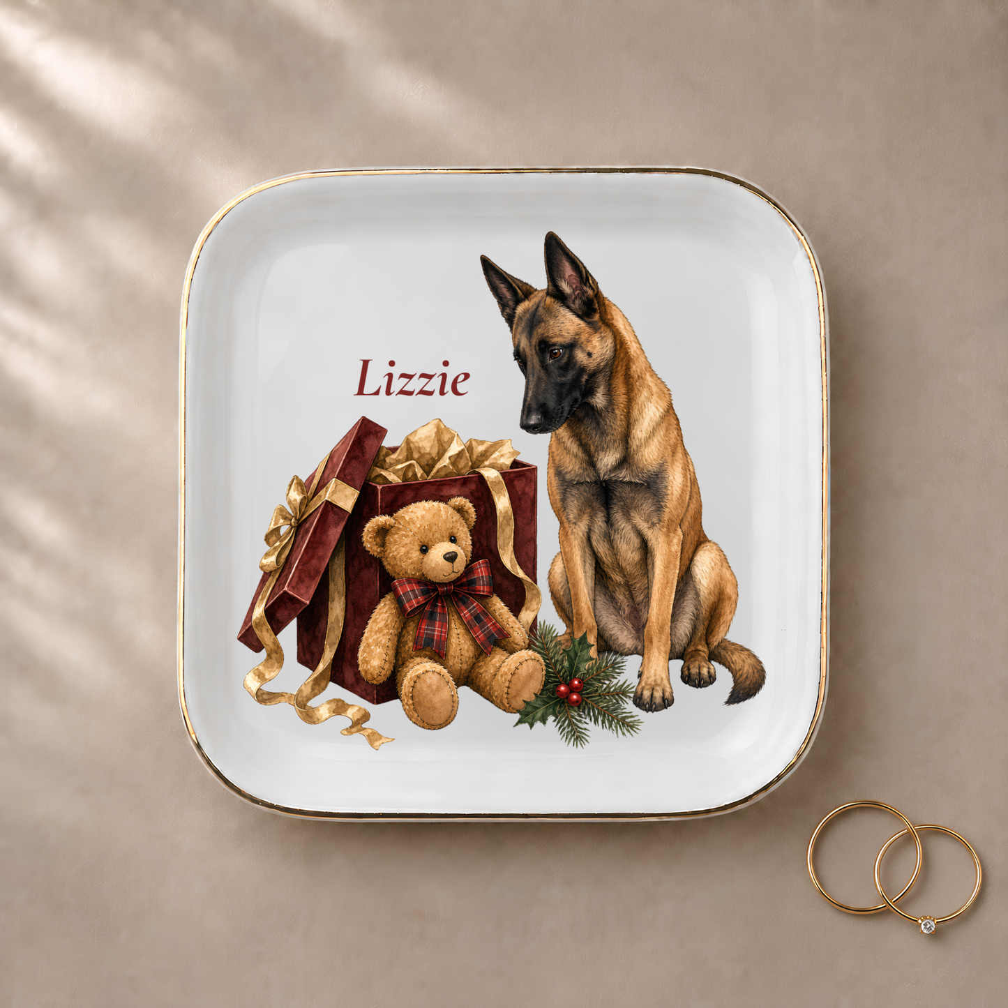 Belgian Malinois jewelry dish styled with gold rings and a personalized name