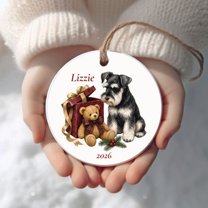 Personalized Black Miniature Schnauzer Christmas ornament held in cupped hands
