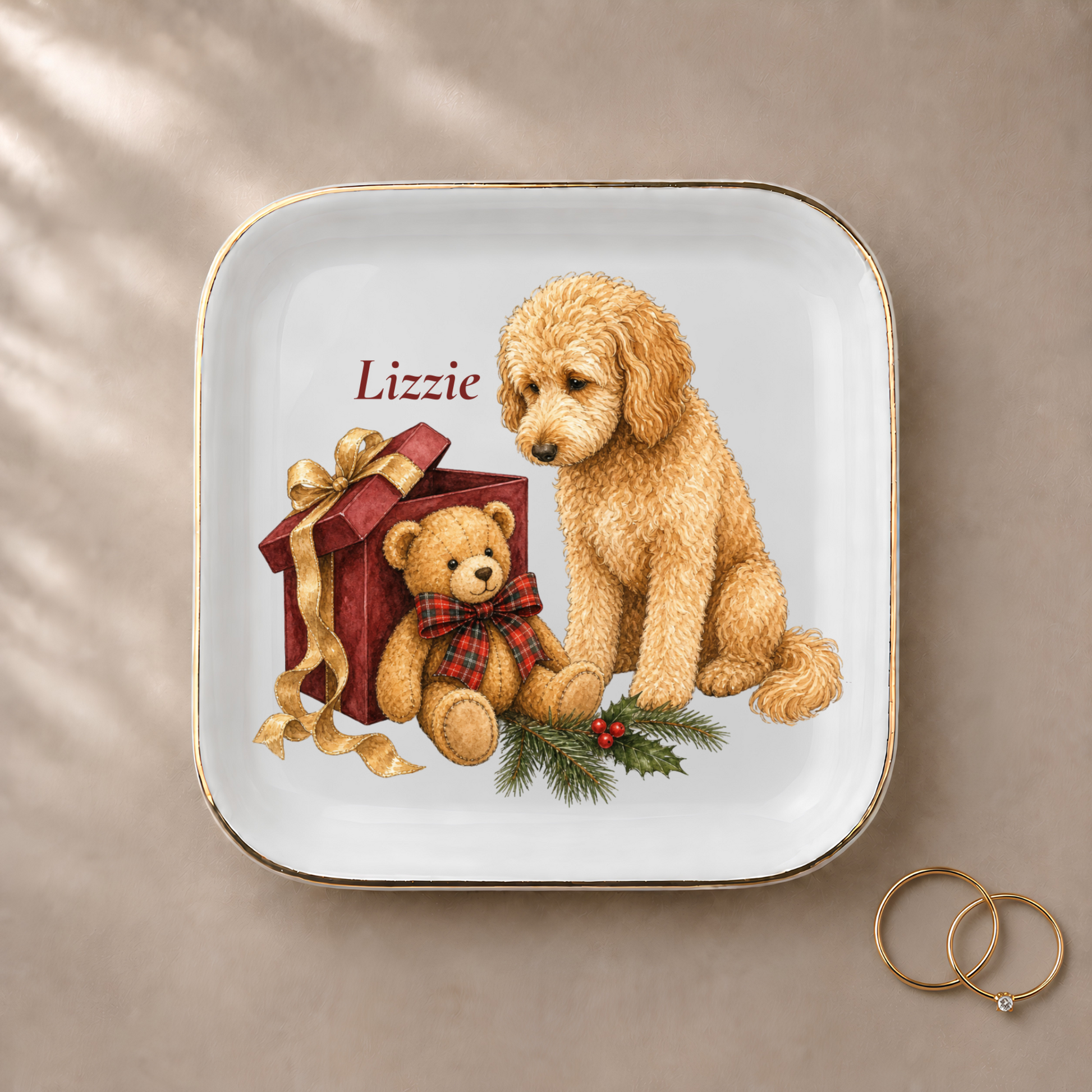 Goldendoodle jewelry dish styled with gold rings and a personalized name