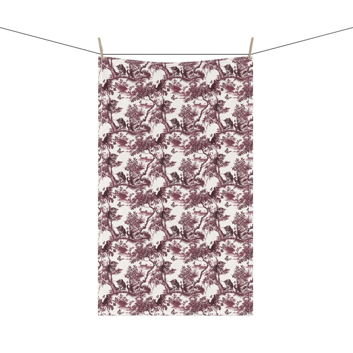 Cat & Butterfly Tea Towel with cranberry toile design, hanging from a clothesline, showing the full repeating design.