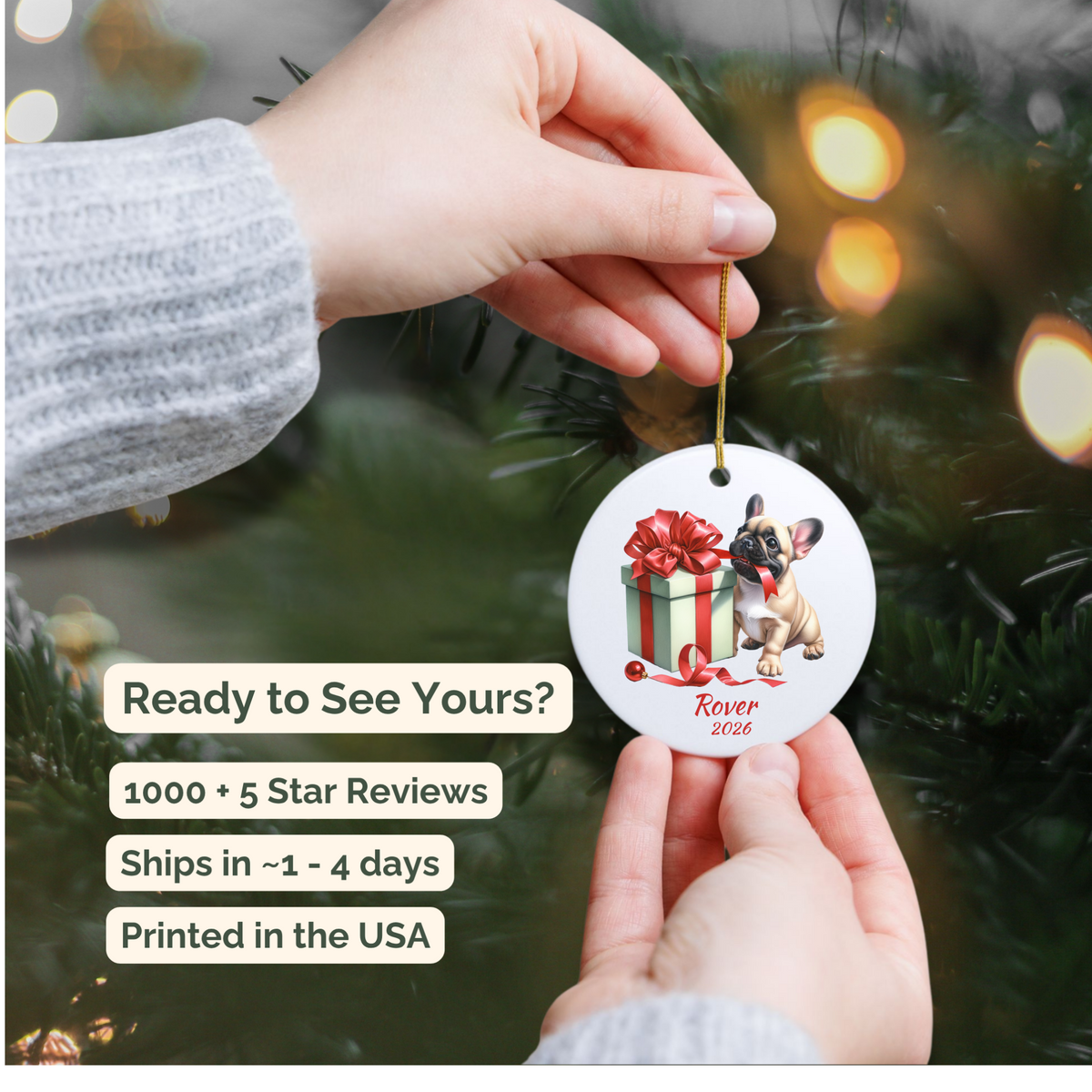 Hand holding a personalized fawn French Bulldog ceramic ornament beside a Christmas tree