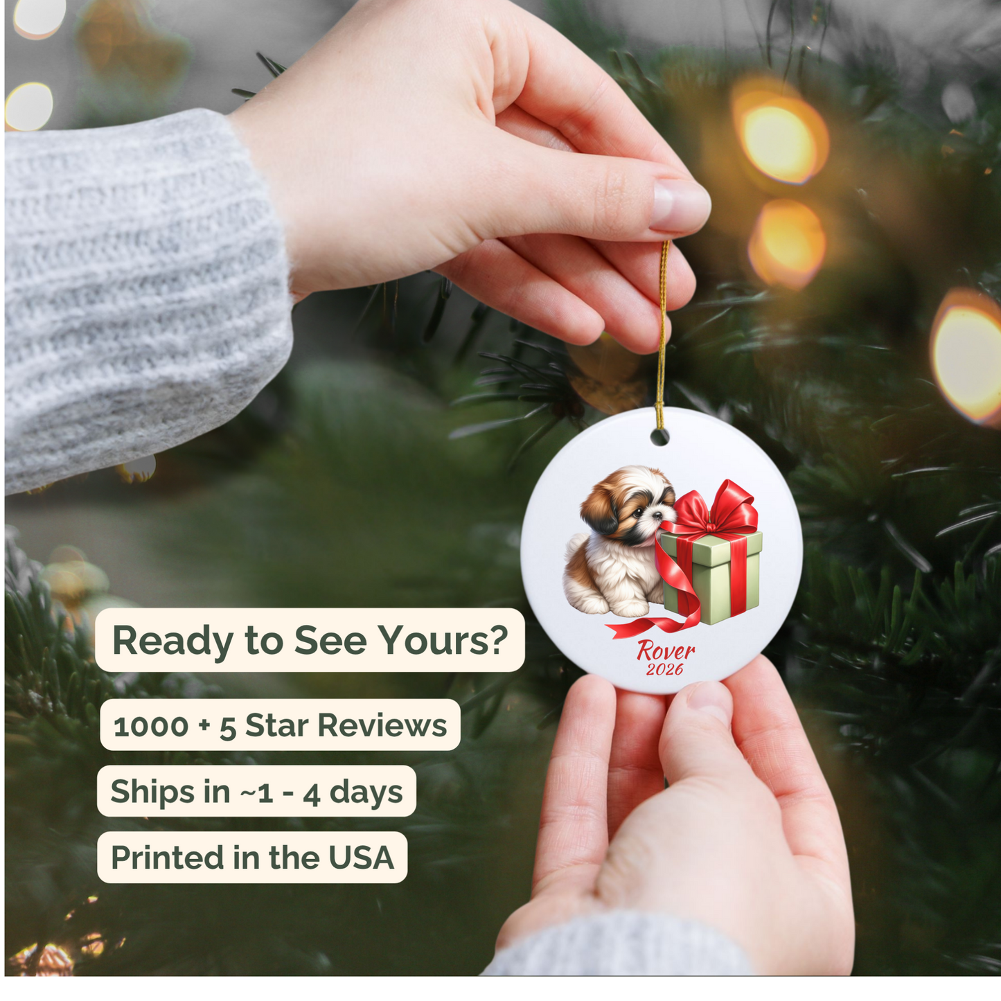 Hand holding a personalized Shih Tzu ceramic ornament beside a Christmas tree