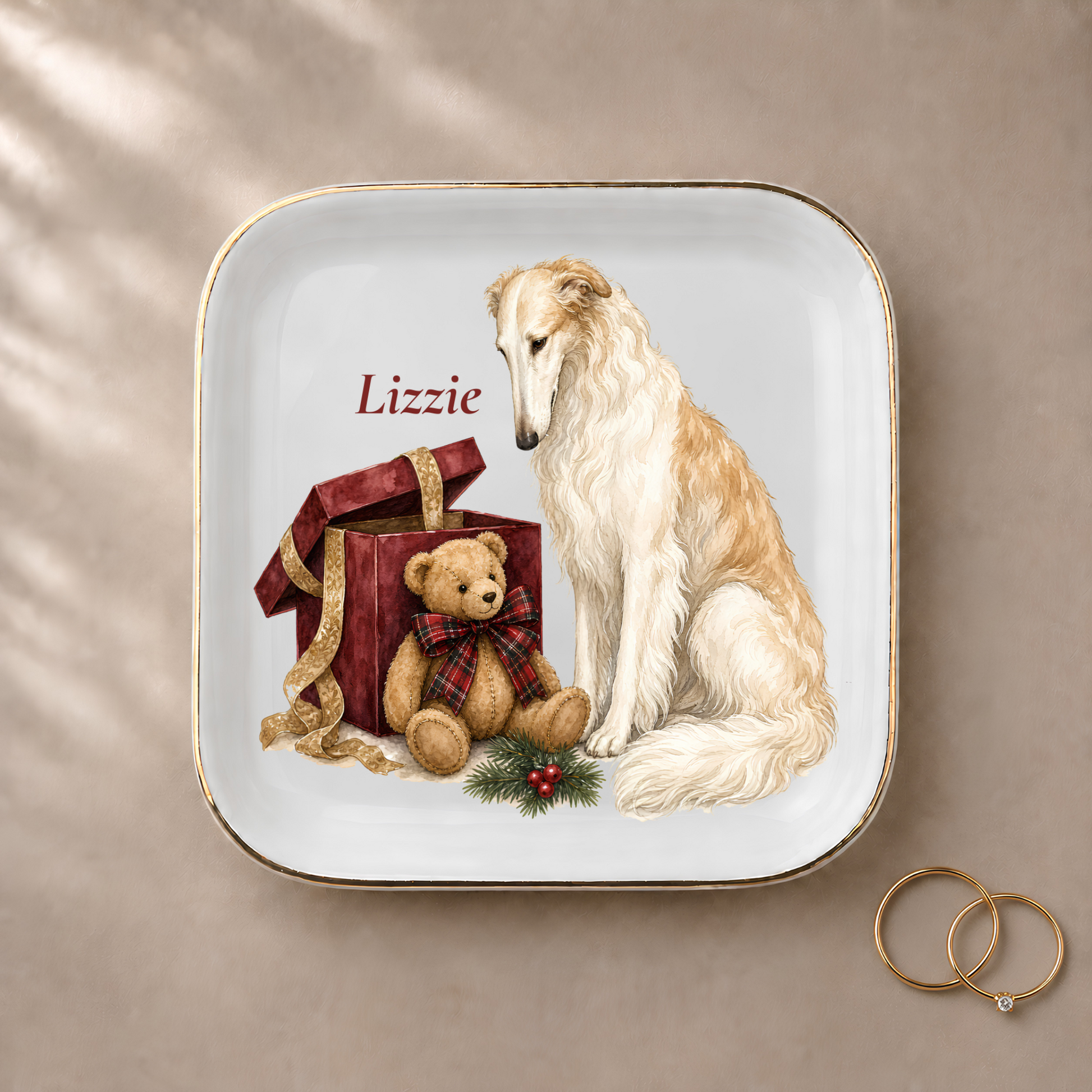 Borzoi jewelry dish styled with gold rings and a personalized name