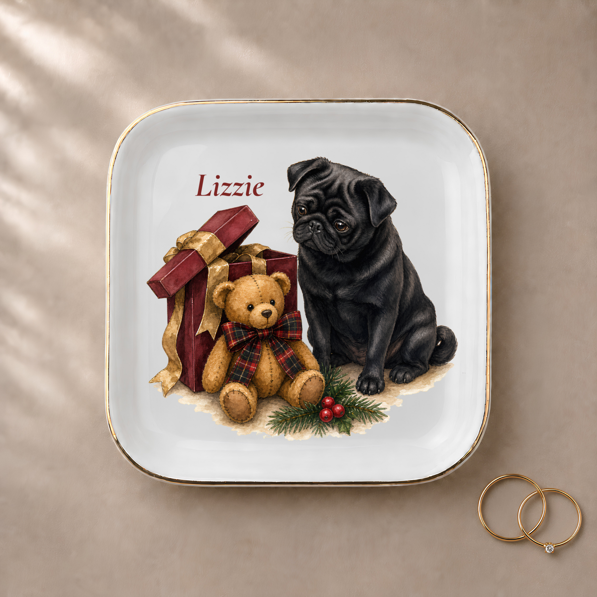 Pug jewelry dish styled with gold rings and a personalized name