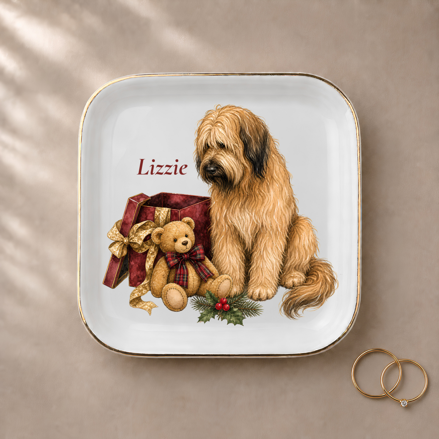 Briard jewelry dish styled with gold rings and a personalized name