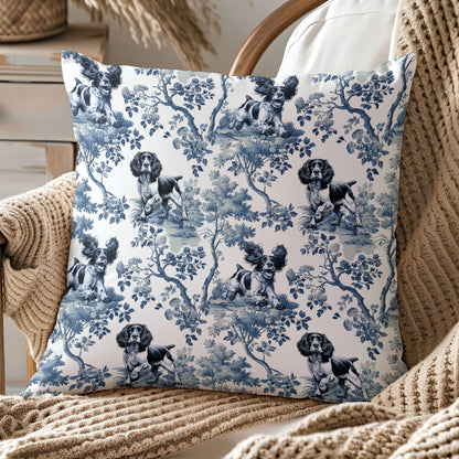 Decorative pillow with an English Springer Spaniel dog toile pattern on a chair with beige blanket