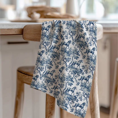 Horse Tea Towel with blue toile design, draped over a wooden chair in a kitchen.