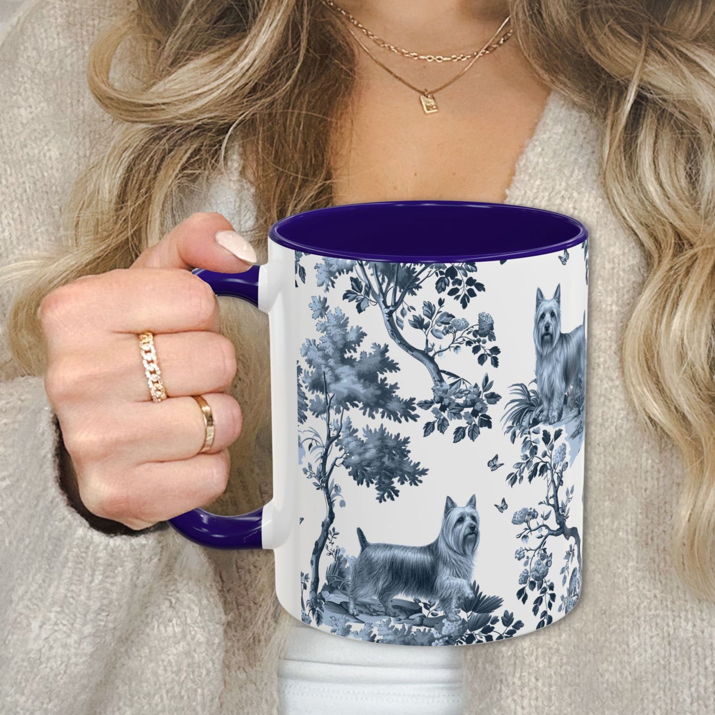 Blue toile Silky Terrier coffee cup against a cozy beige sweater