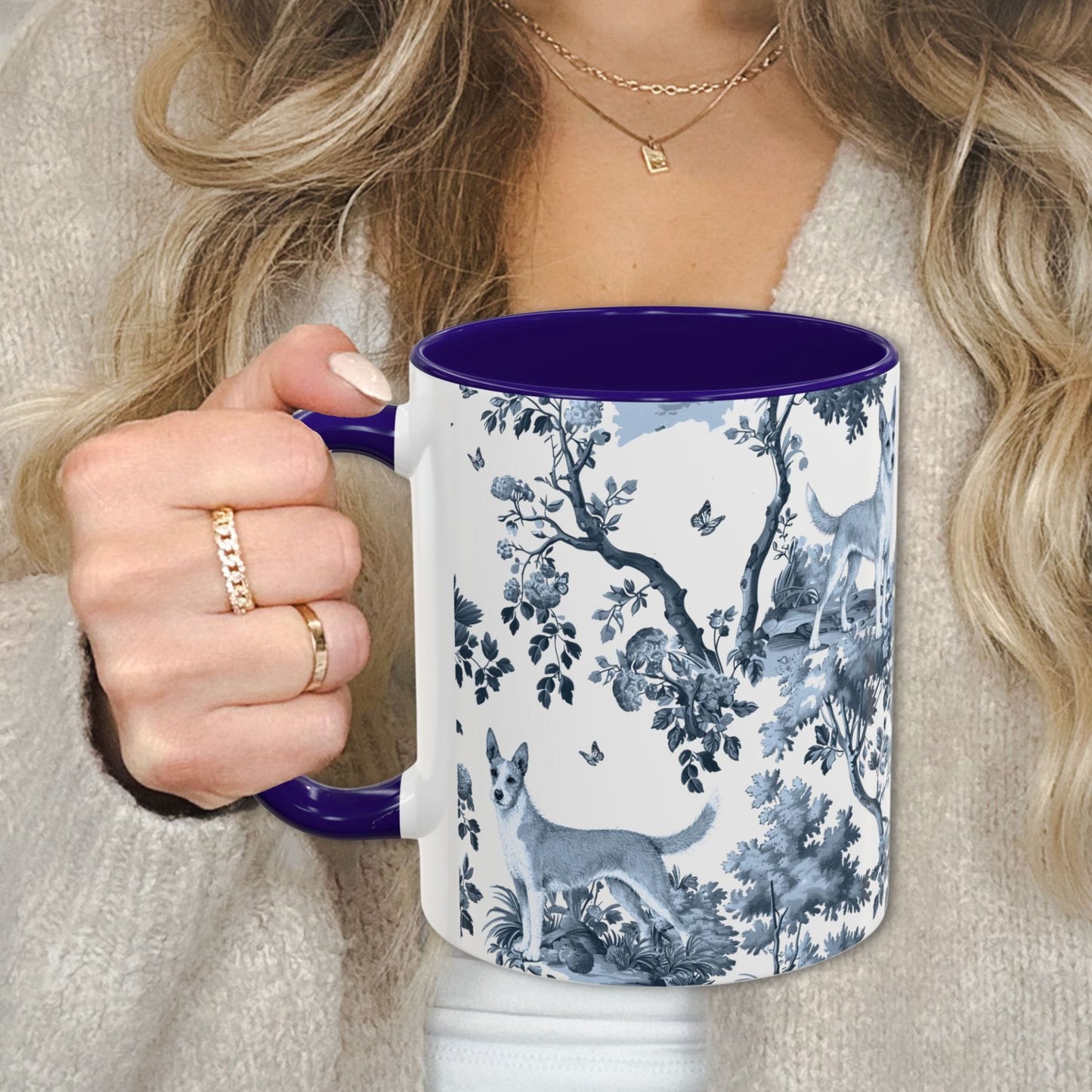 Blue toile Portuguese Podengo coffee cup against a cozy beige sweater