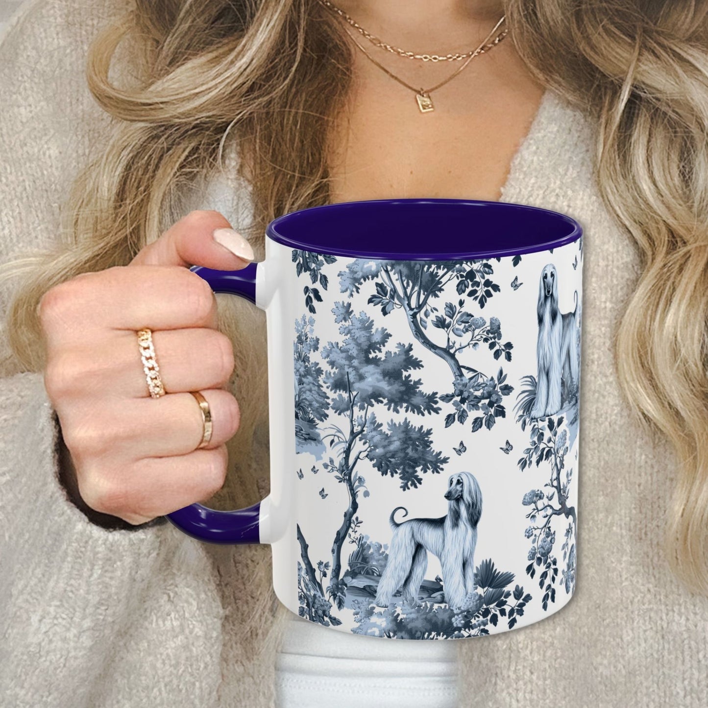 Blue toile Afghan Hound coffee cup against a cozy beige sweater