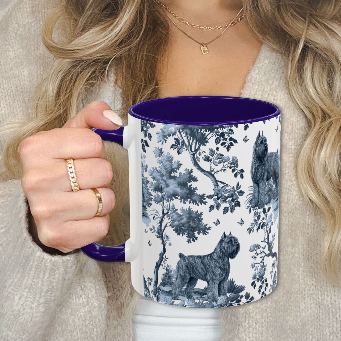 Blue toile Bouvier des Flandres coffee cup against a cozy beige sweater