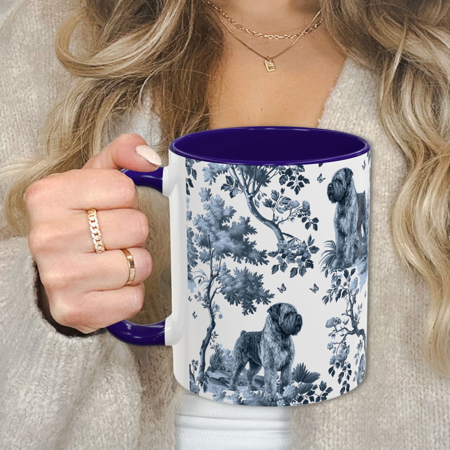 Blue toile Bouvier des Flandres coffee cup against a cozy beige sweater