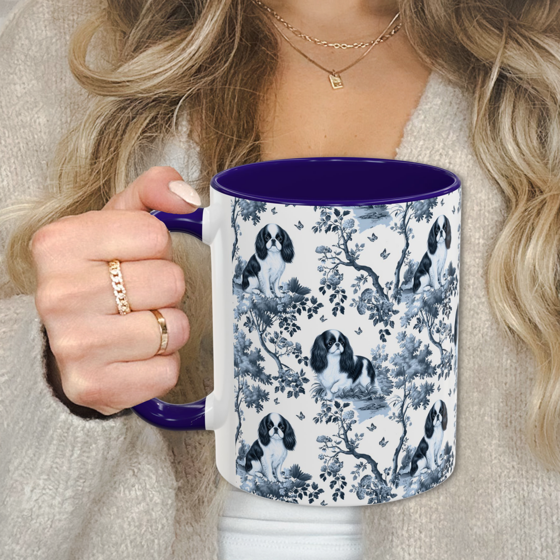 English Toy Spaniel blue toile mug held by a person in a beige sweater