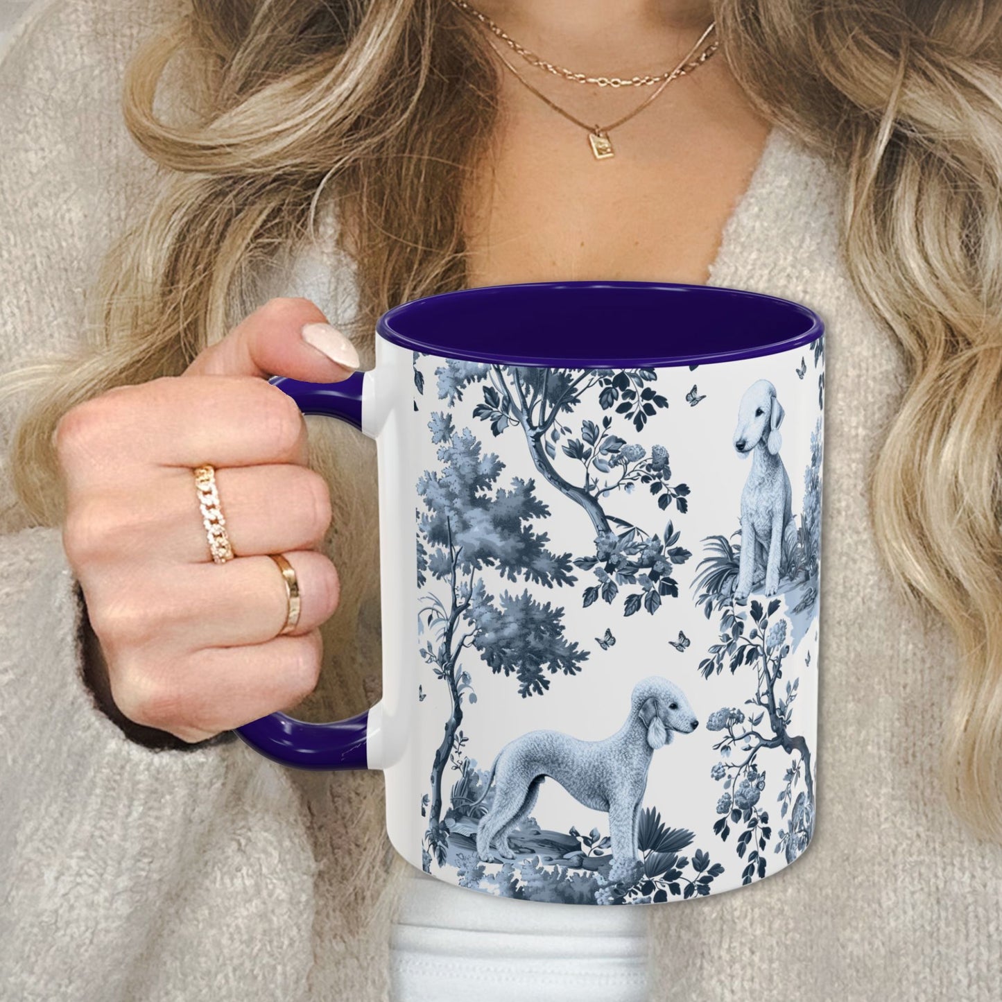 Blue toile Bedlington Terrier coffee cup against a cozy beige sweater