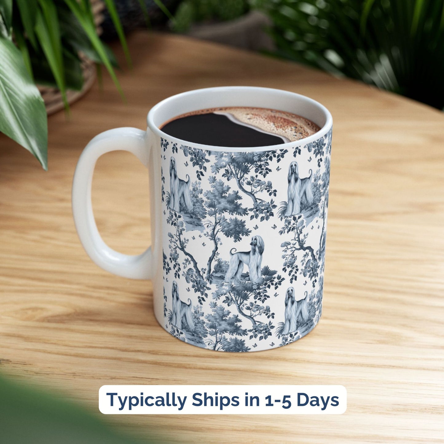 Blue toile Afghan Hound coffee cup styled on a wooden board in a festive setting