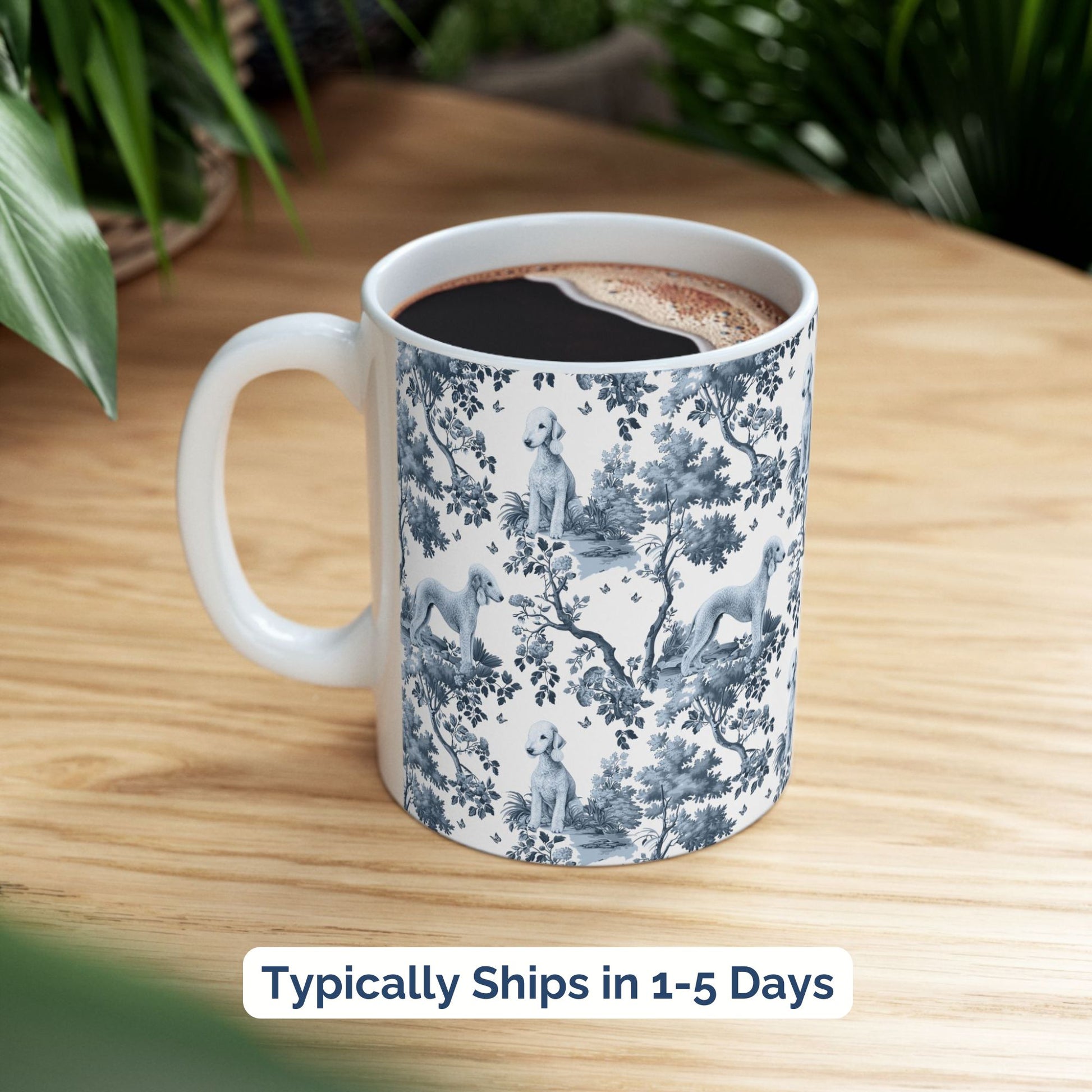 Blue toile Bedlington Terrier coffee cup styled on a wooden board in a festive setting