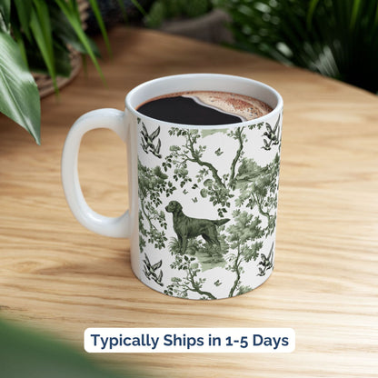 Sage green toile Flat-Coated Retriever coffee cup styled on a wooden board in a festive setting