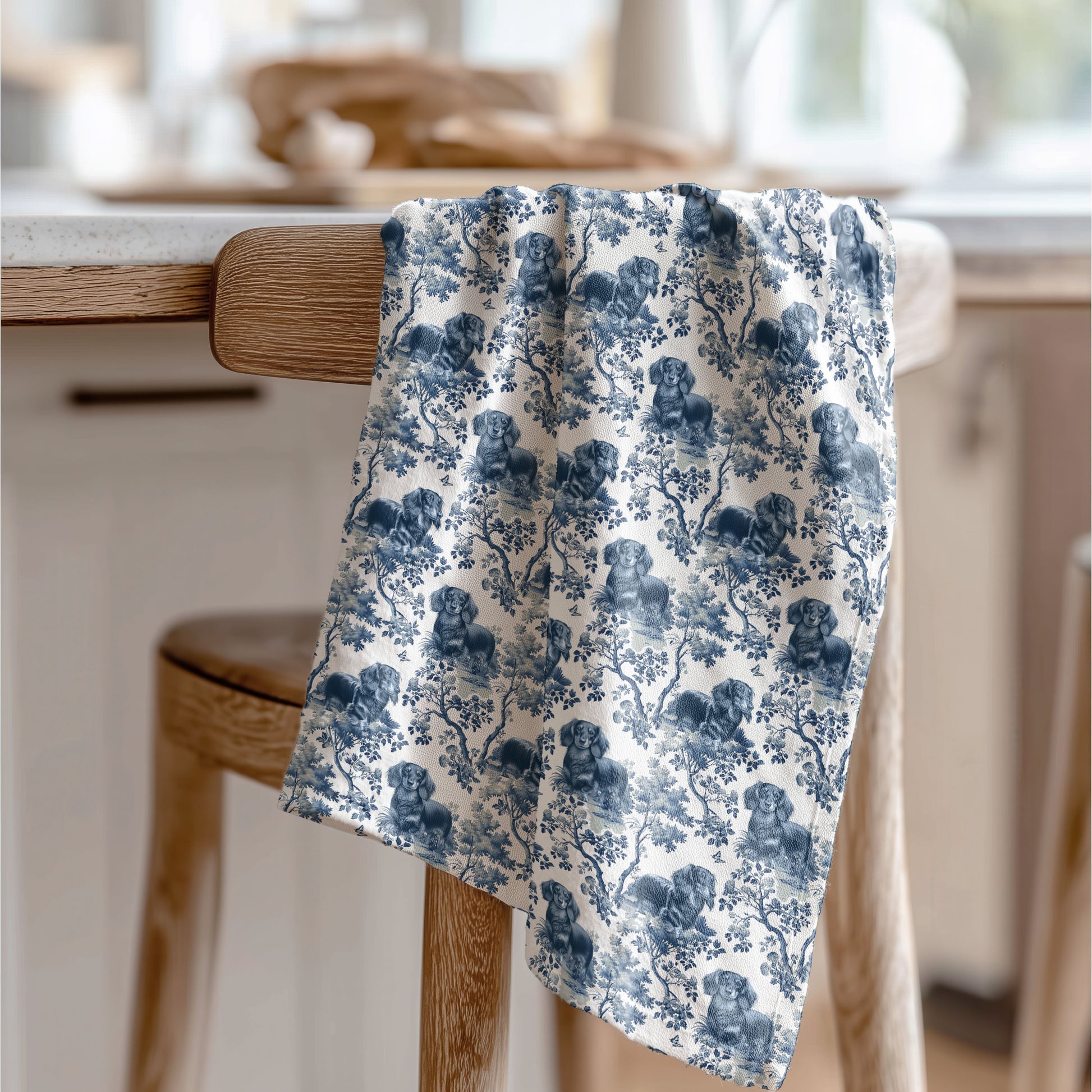 Longhaired Dachshund blue toile tea towel displayed in a kitchen