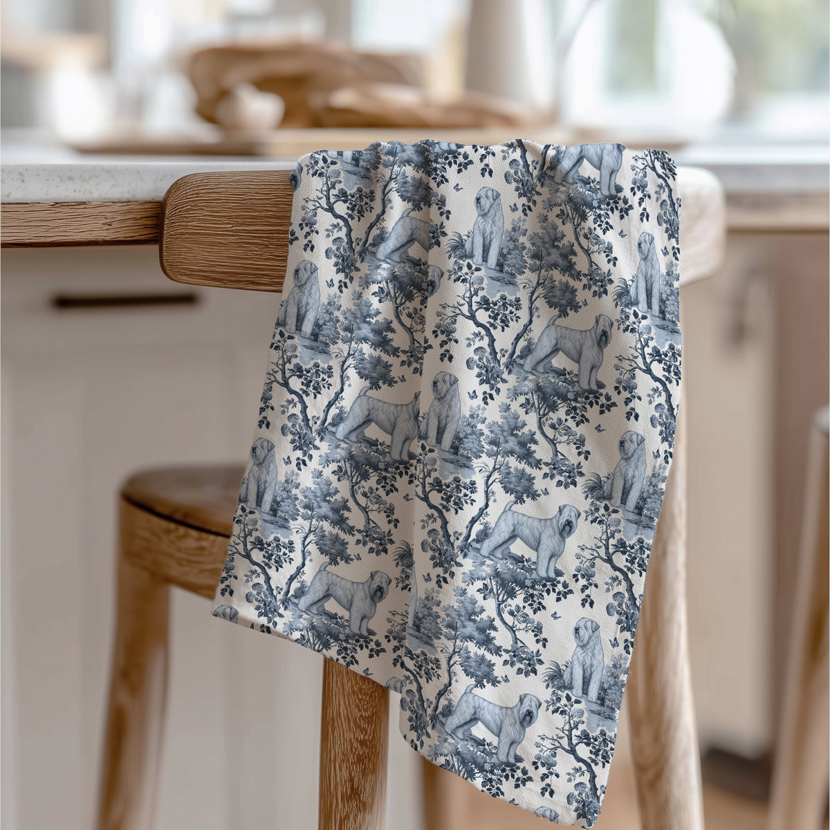 Soft Coated Wheaten Terrier Tea Towel with blue toile design, draped over a wooden chair in a kitchen.