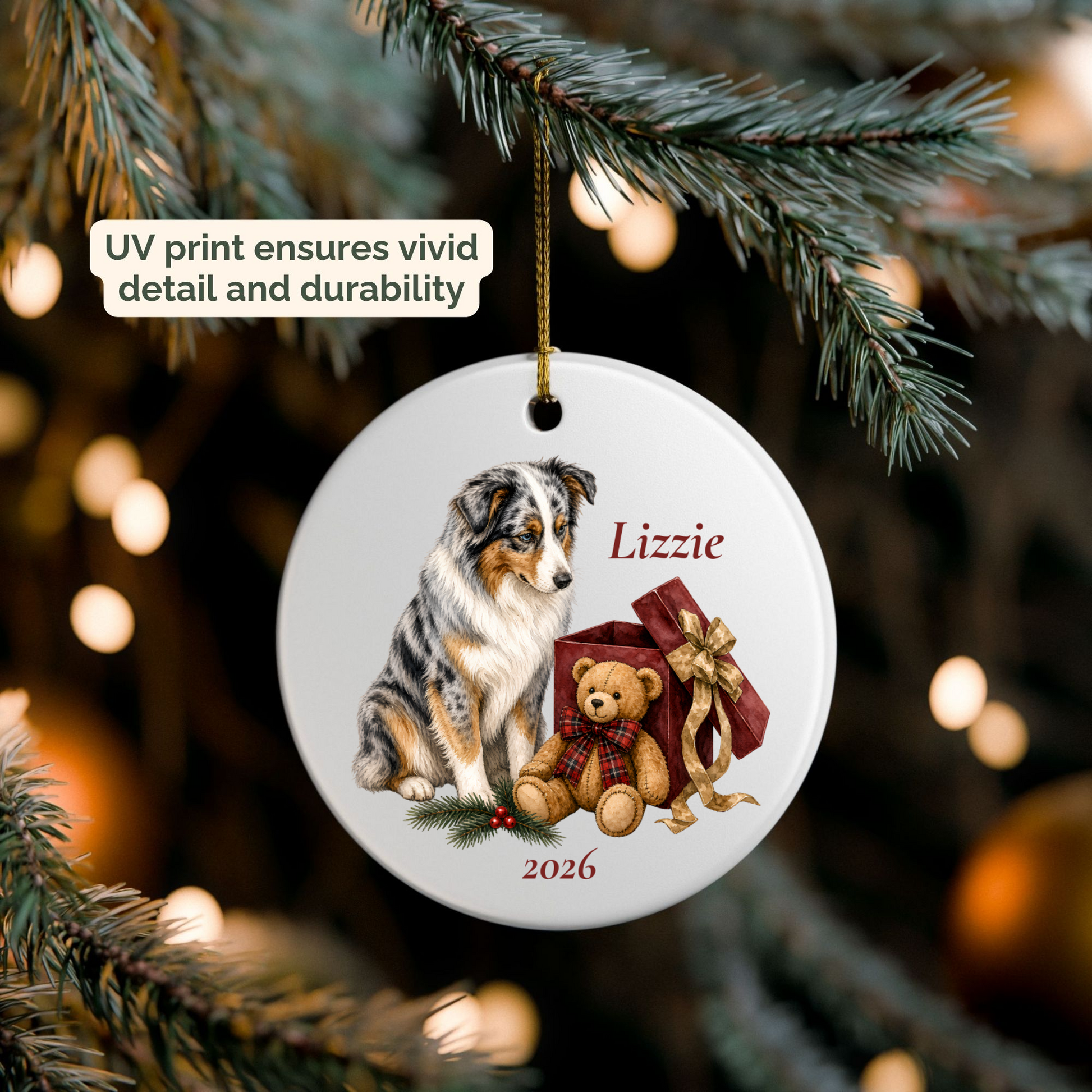 Personalized Australian Shepherd ornament hanging on a lit Christmas tree