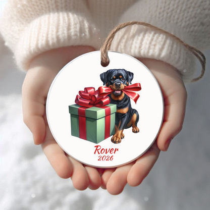 Personalized Rottweiler Christmas ornament held in cupped hands