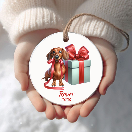 Personalized red Dachshund Christmas ornament held in cupped hands