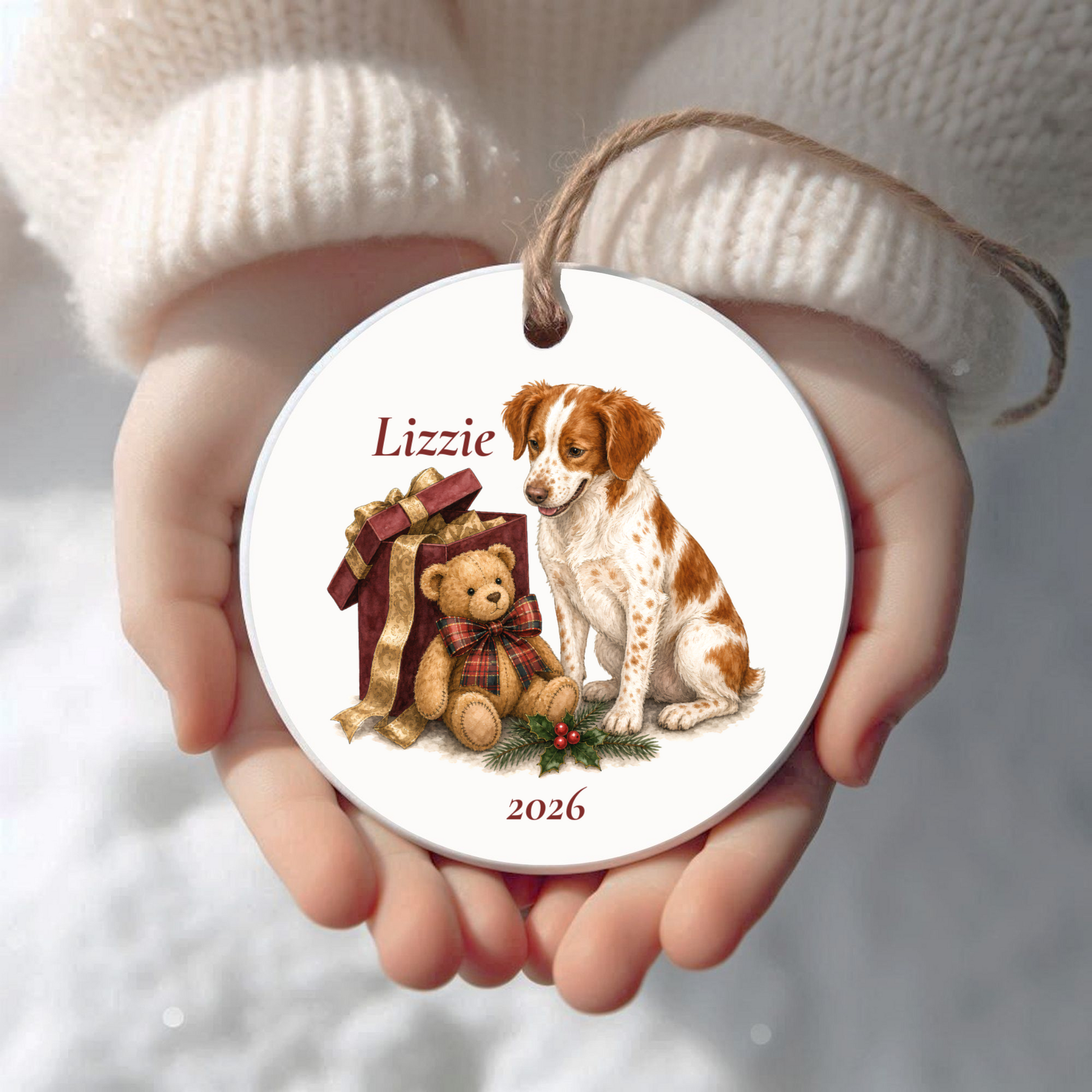 Personalized Brittany Spaniel Christmas ornament held in cupped hands