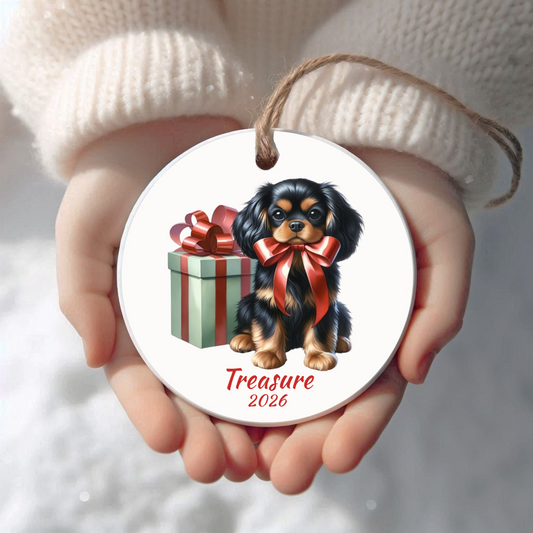 Personalized Black and Tan Cavalier King Charles Spaniel Christmas ornament held in cupped hands