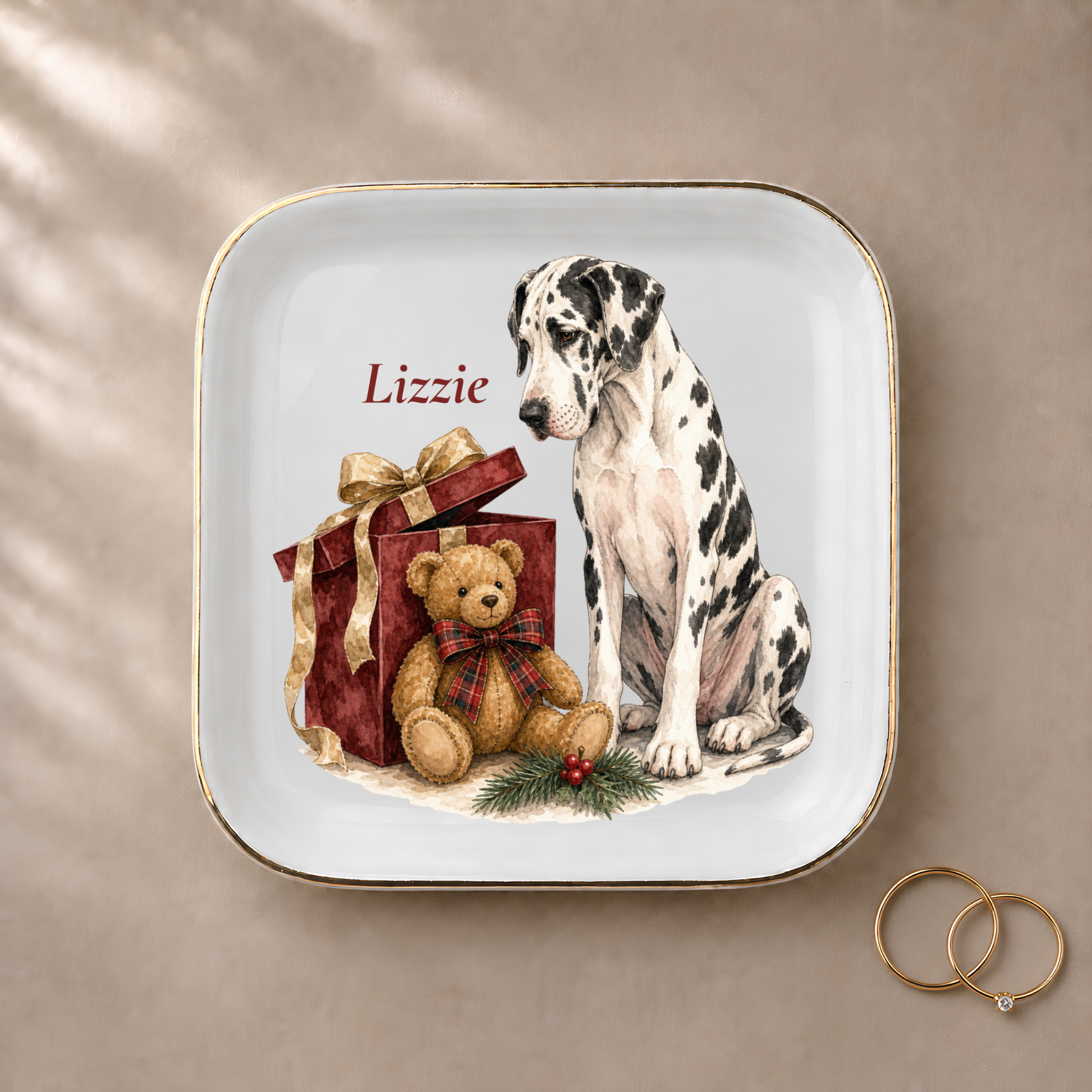 Great Dane jewelry dish styled with gold rings and a personalized name