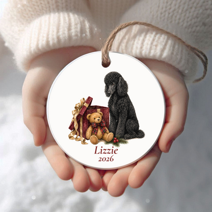 Personalized Standard Poodle (Black) Christmas ornament held in cupped hands