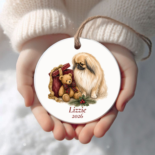 Personalized Pekingese Christmas ornament held in cupped hands