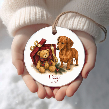 Personalized Red Dachshund Christmas ornament held in cupped hands