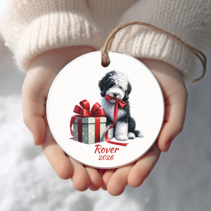 Personalized Sheepadoodle Christmas ornament held in cupped hands