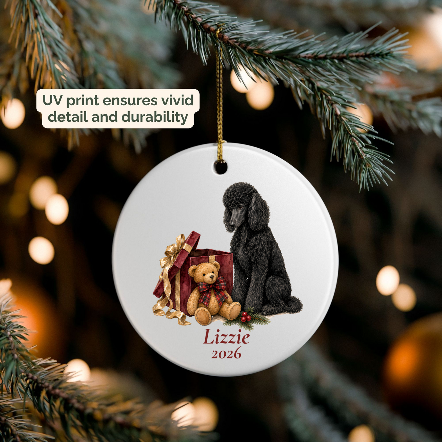Personalized Standard Poodle (Black) ornament hanging on a lit Christmas tree
