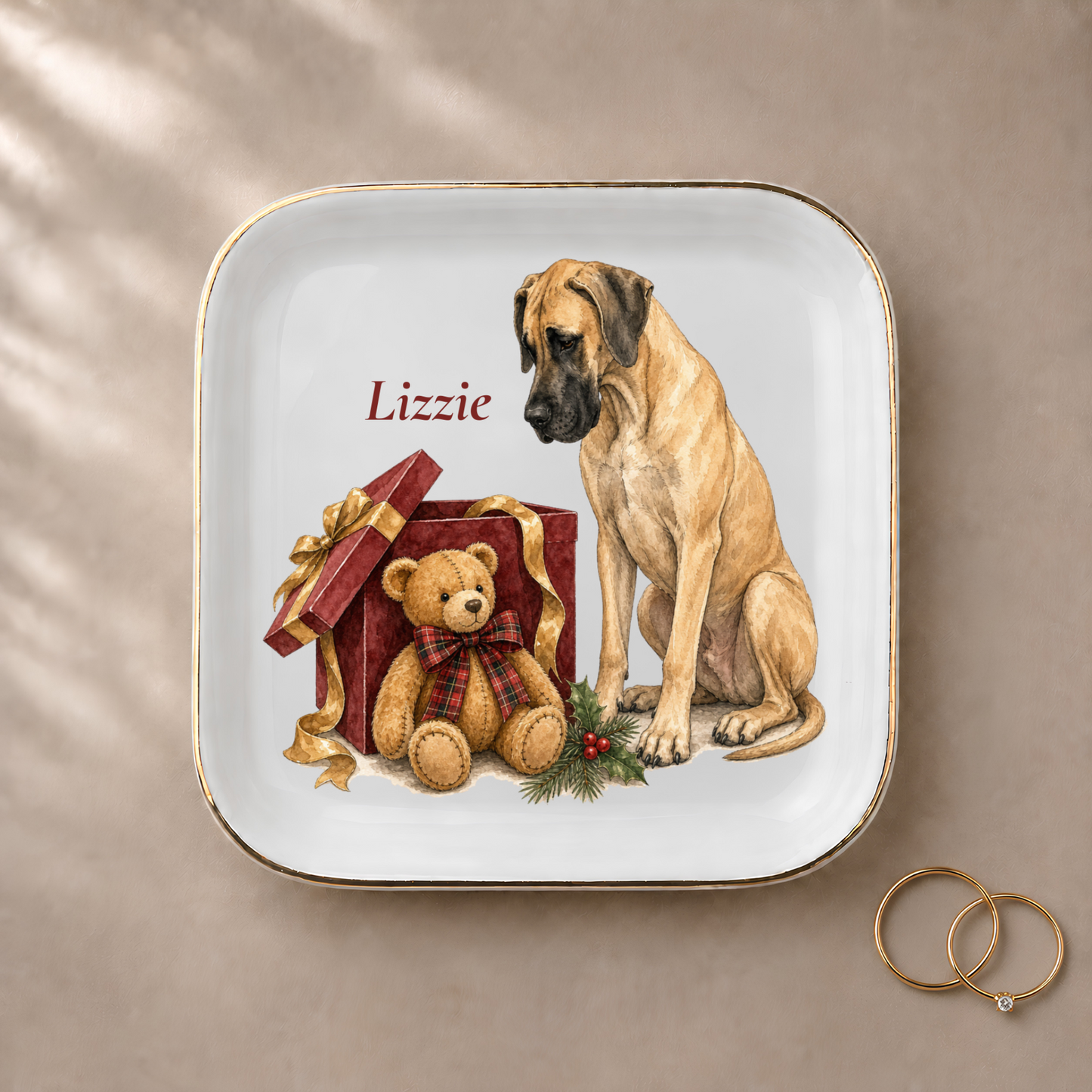 Great Dane jewelry dish styled with gold rings and a personalized name