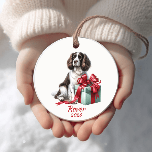 Personalized English Springer Spaniel Christmas ornament held in cupped hands