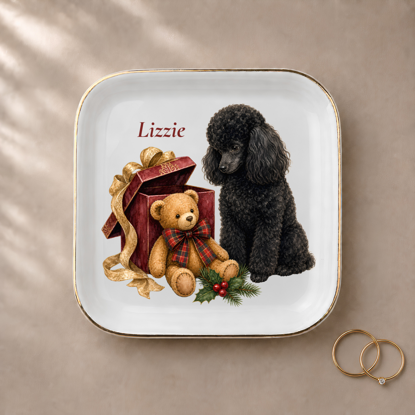 Miniature Poodle jewelry dish styled with gold rings and a personalized name