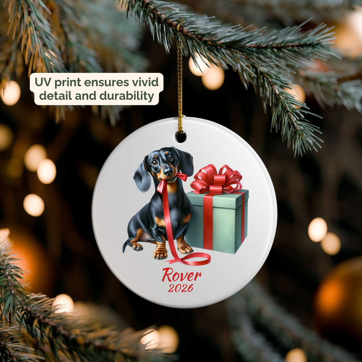 Personalized black and tan Dachshund ornament hanging on a lit Christmas tree