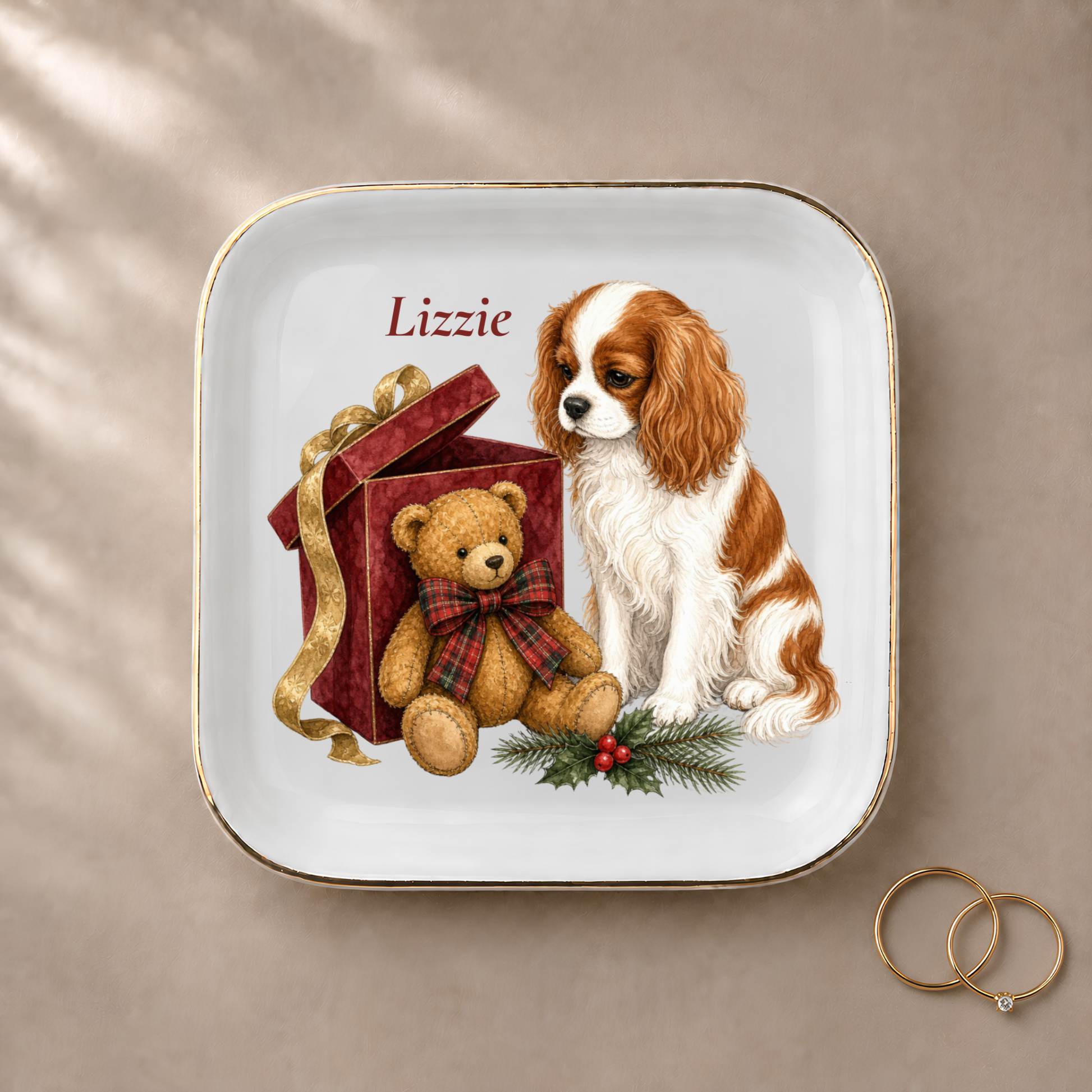 Cavalier King Charles Spaniel jewelry dish styled with gold rings and a personalized name