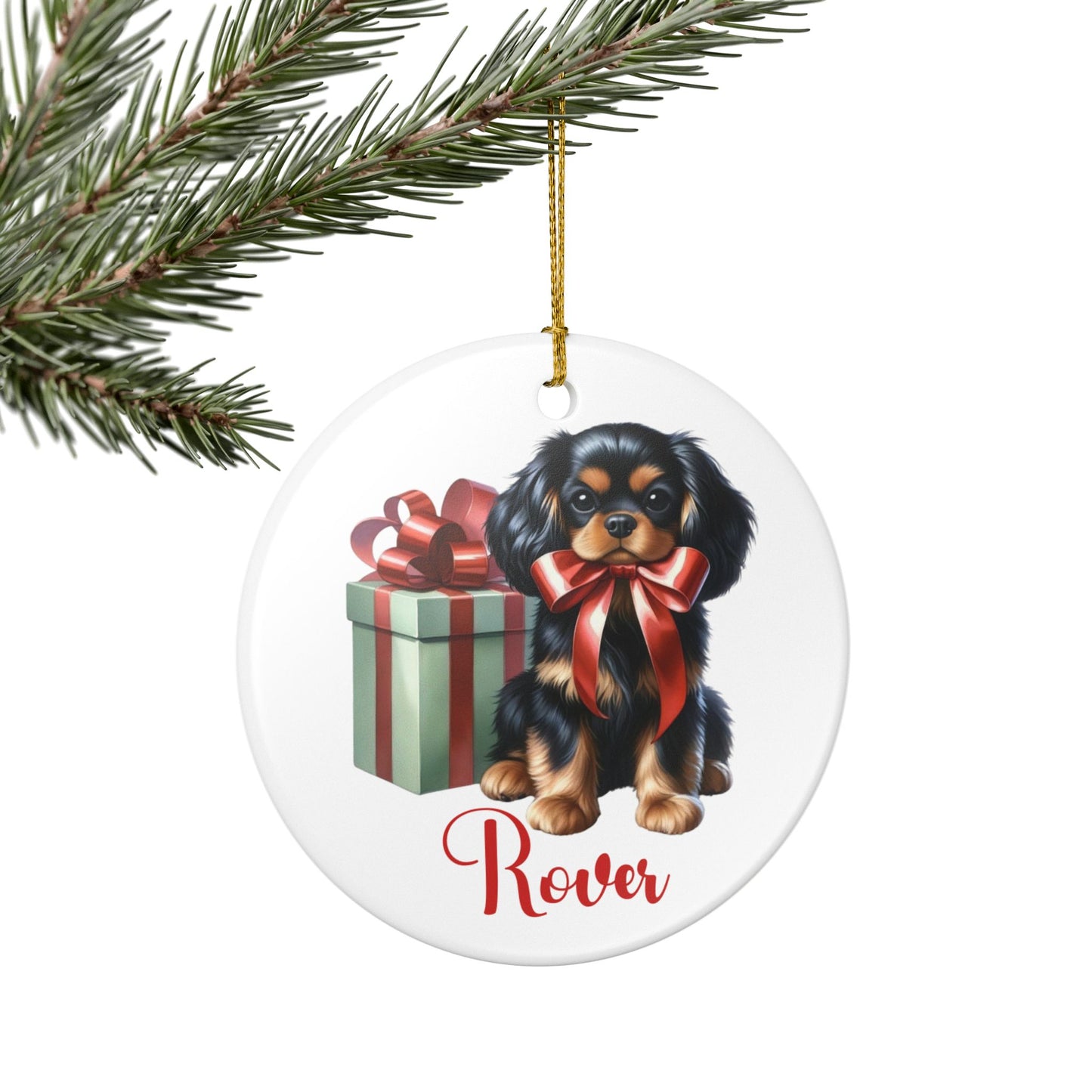 Christmas ornament with a Cavalier King Charles Spaniel dog and gift box design, featuring the name 'Rover' as a placeholder.