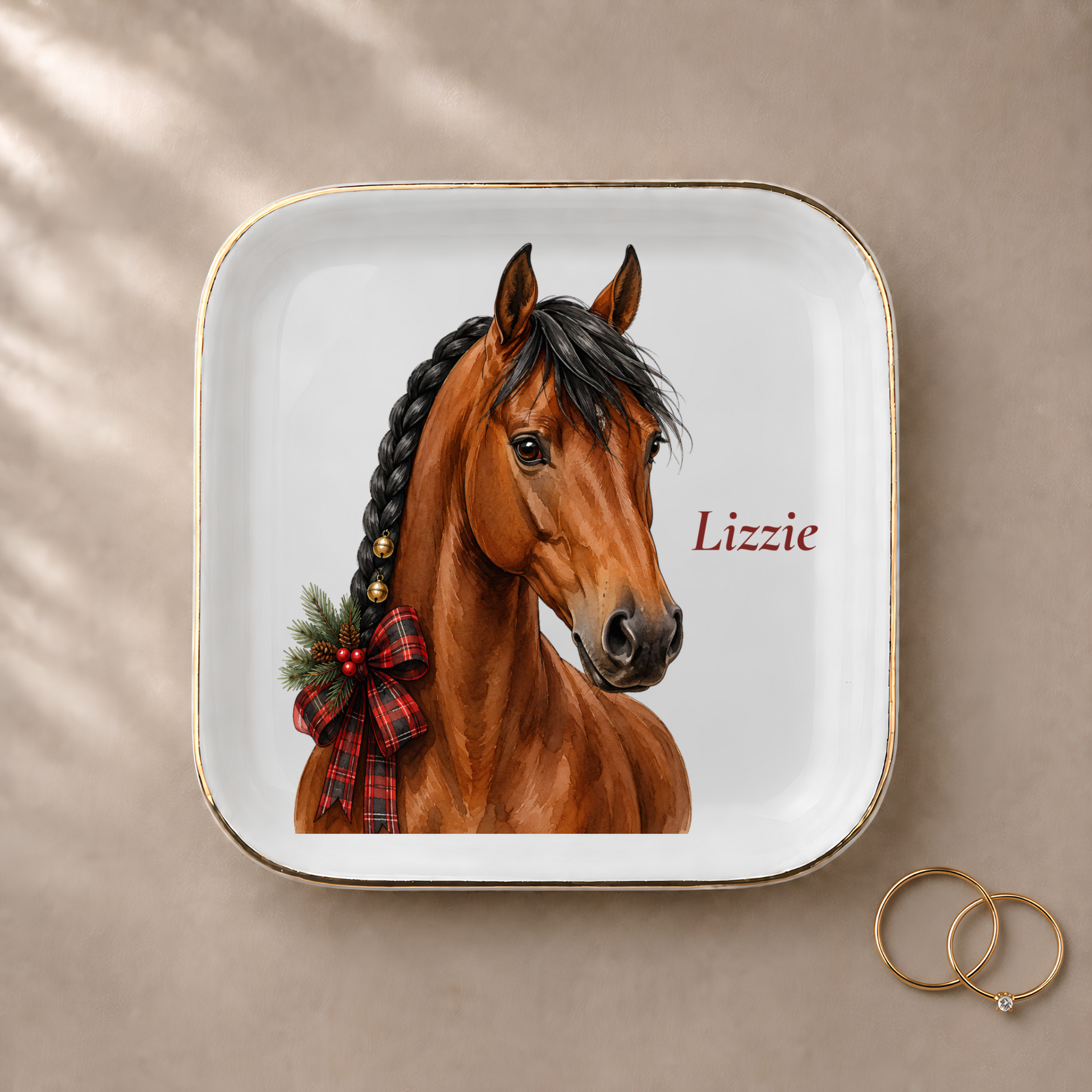Bay horse jewelry dish styled with gold rings and a personalized name