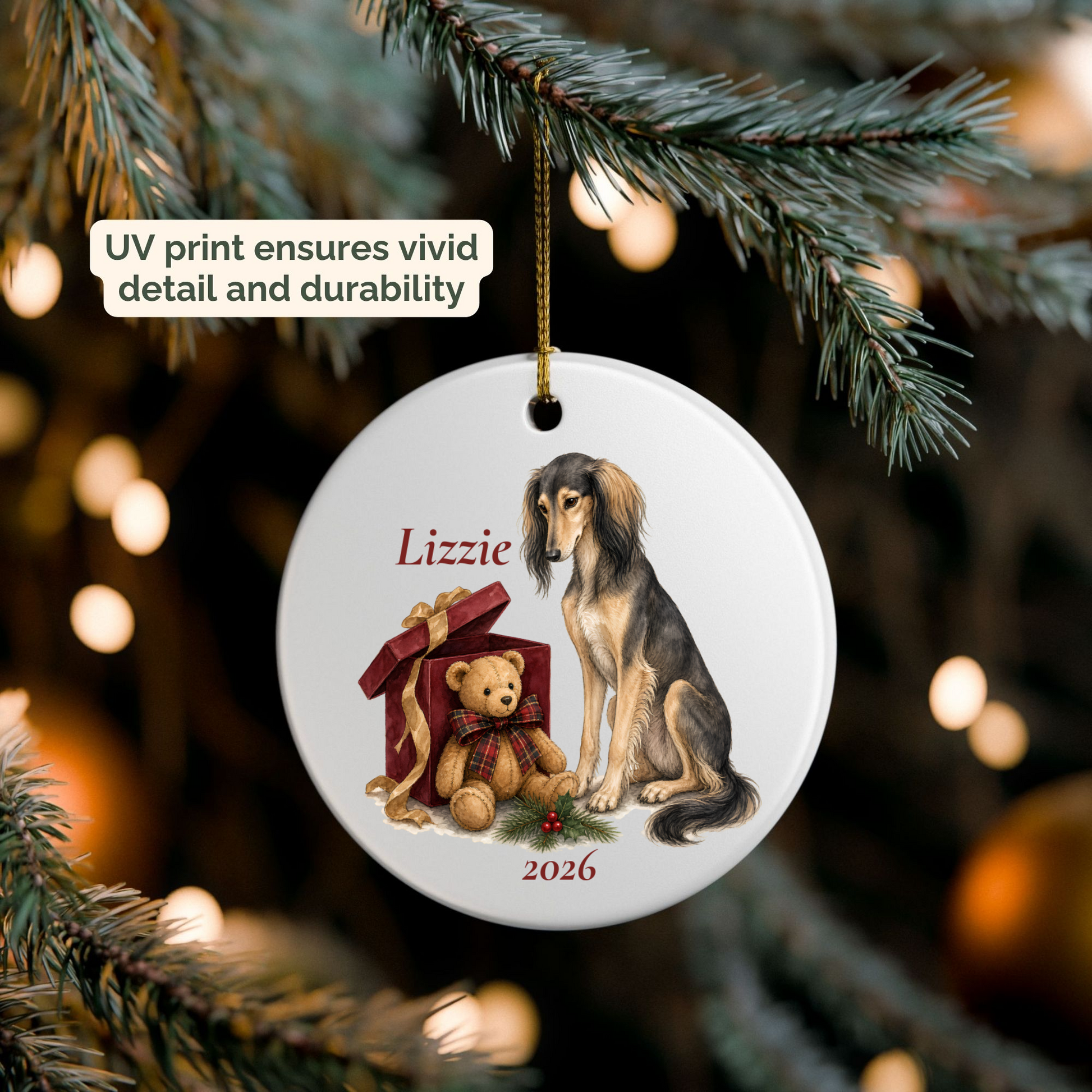 Personalized Saluki ornament hanging on a lit Christmas tree
