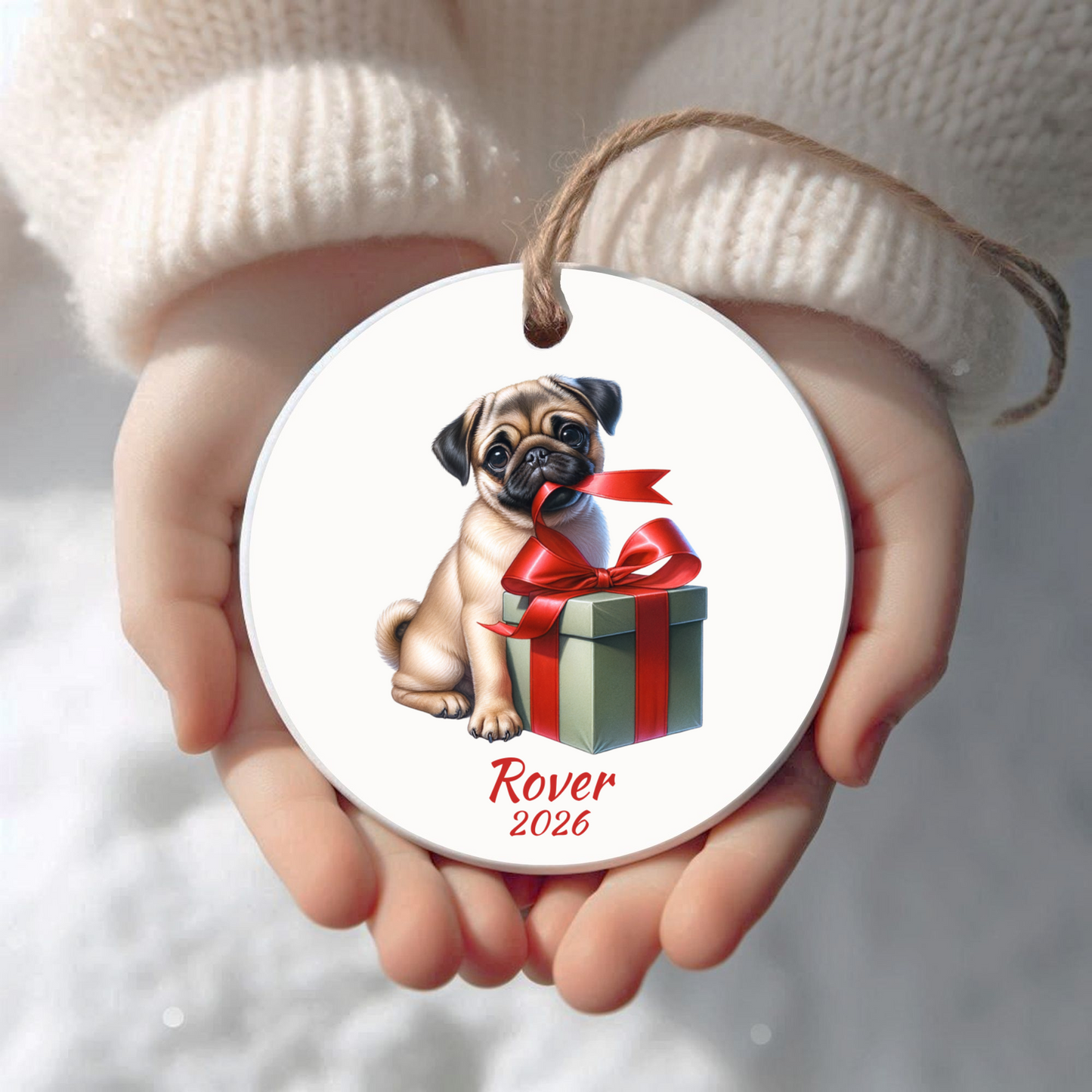 Personalized fawn Pug Christmas ornament held in cupped hands