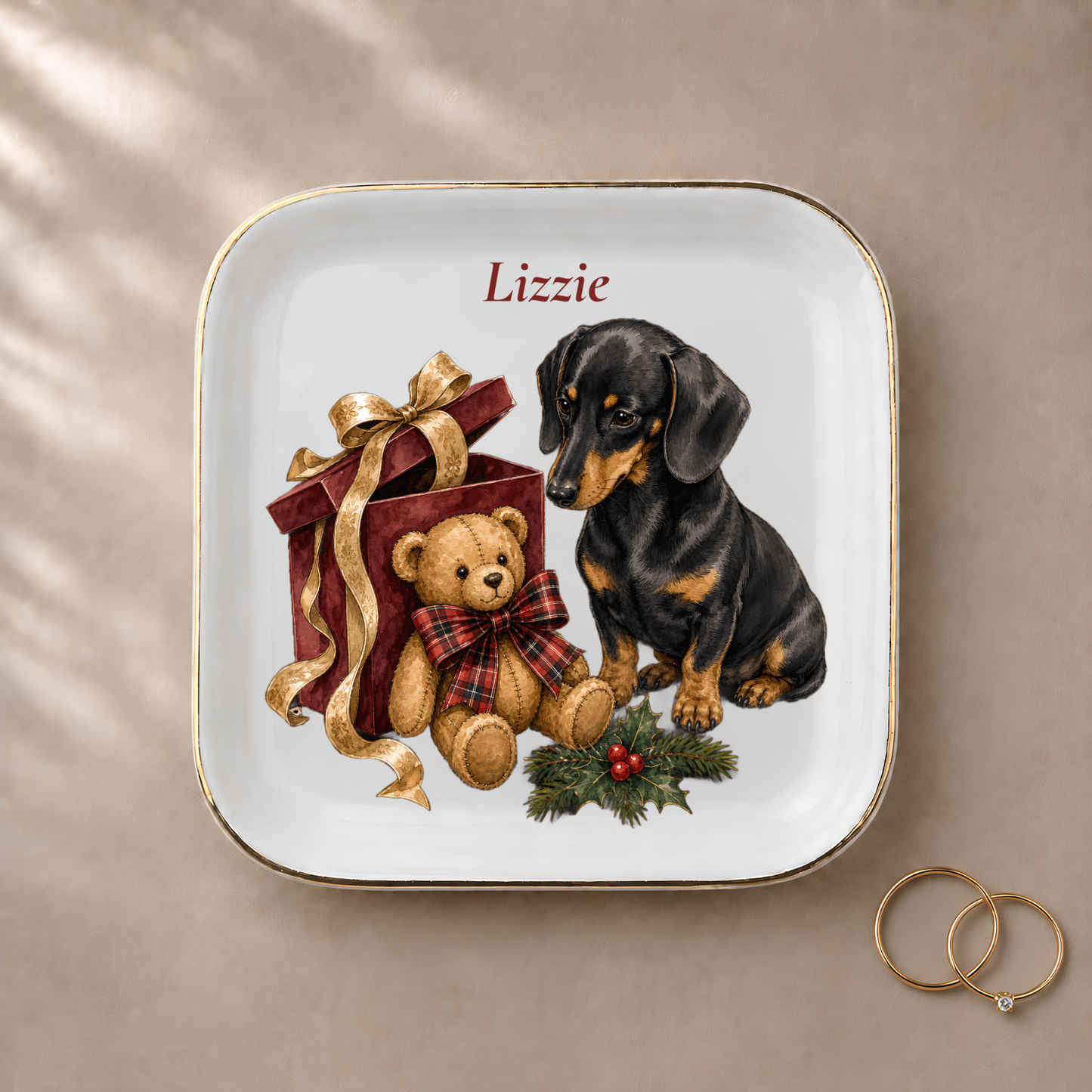Dachshund jewelry dish styled with gold rings and a personalized name