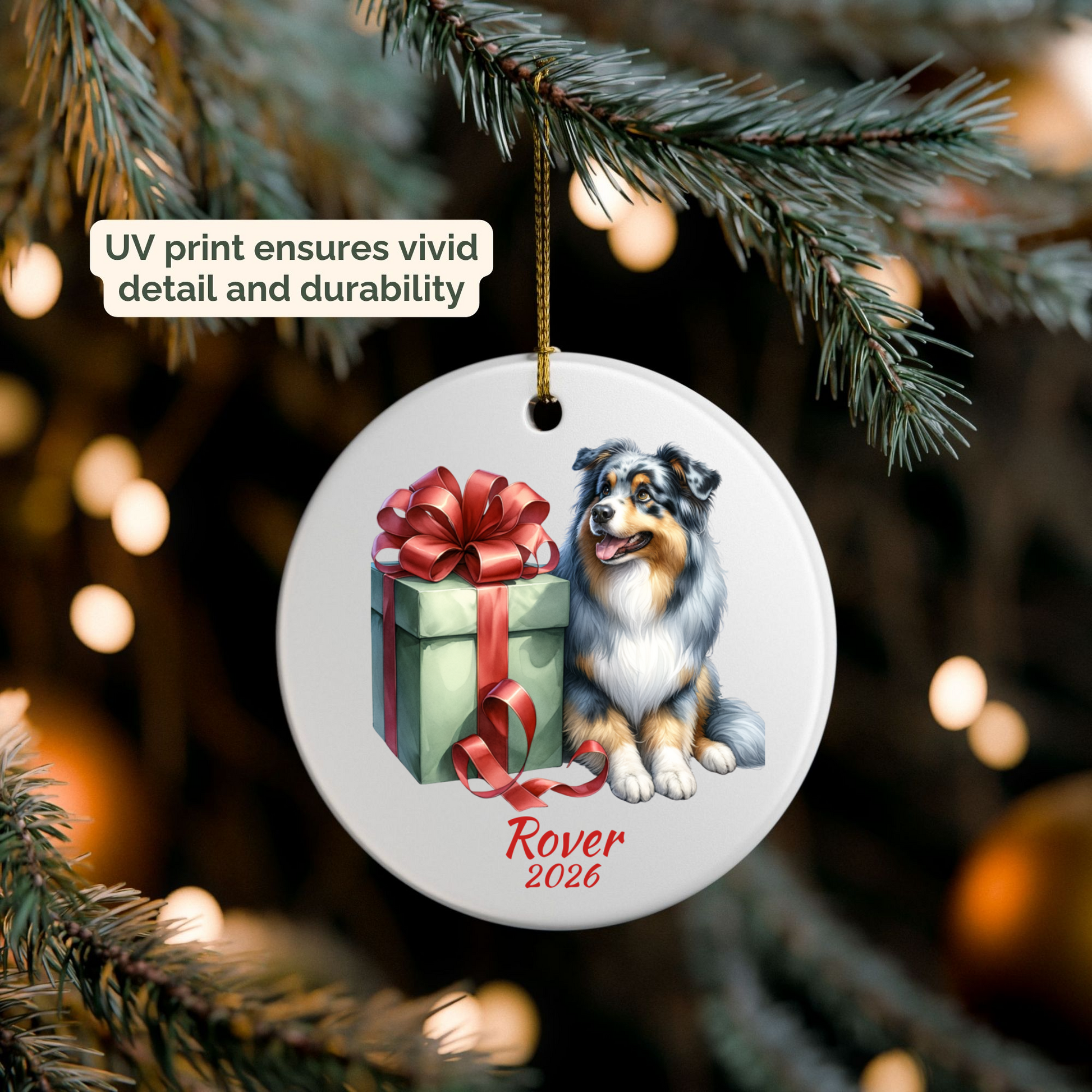 Personalized Australian Shepherd ornament hanging on a lit Christmas tree