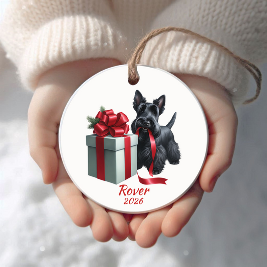 Personalized Scottish Terrier Christmas ornament held in cupped hands