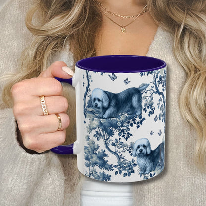 Blue toile Dandie Dinmont Terrier coffee cup against a cozy beige sweater
