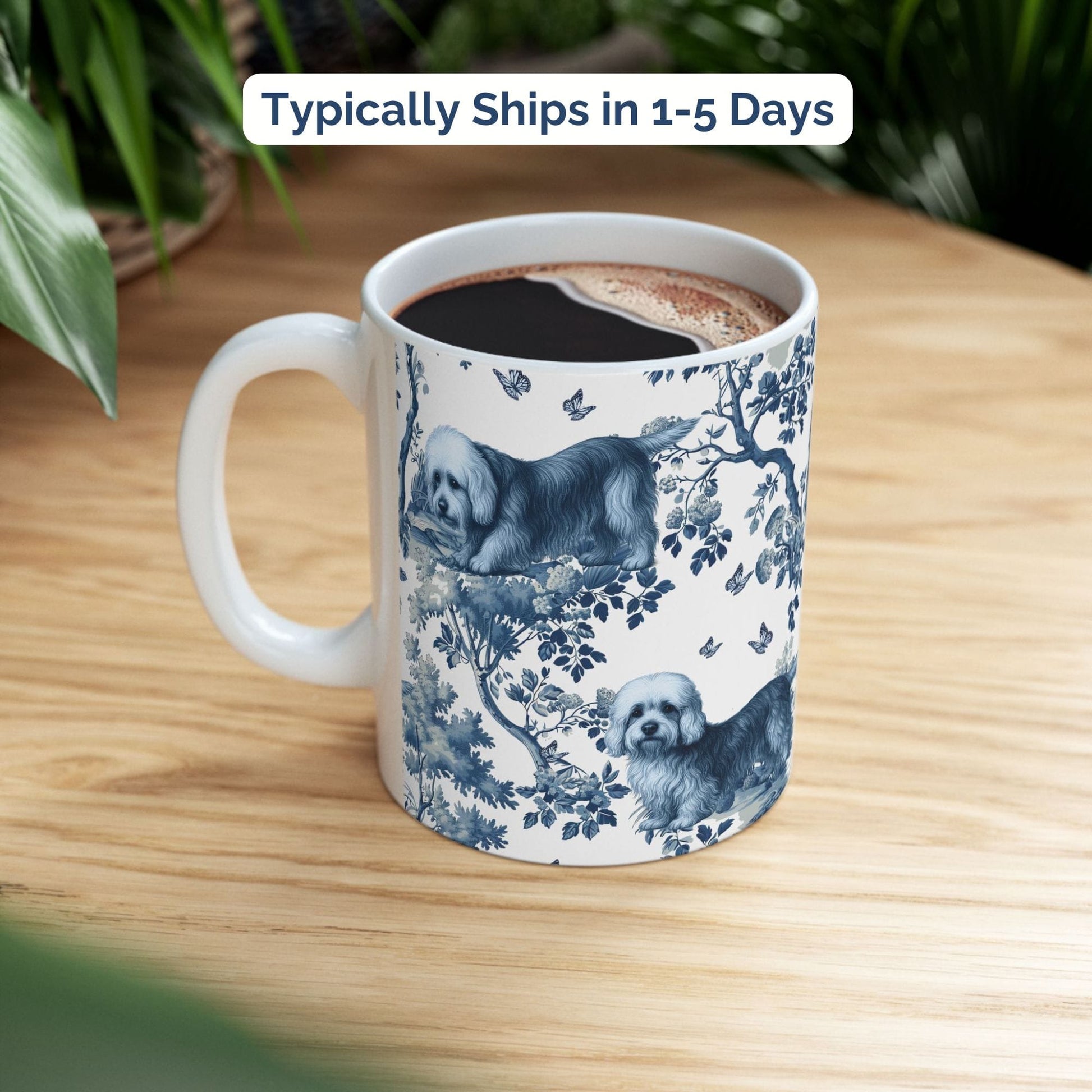 Blue toile Dandie Dinmont Terrier coffee cup styled on a wooden board in a festive setting